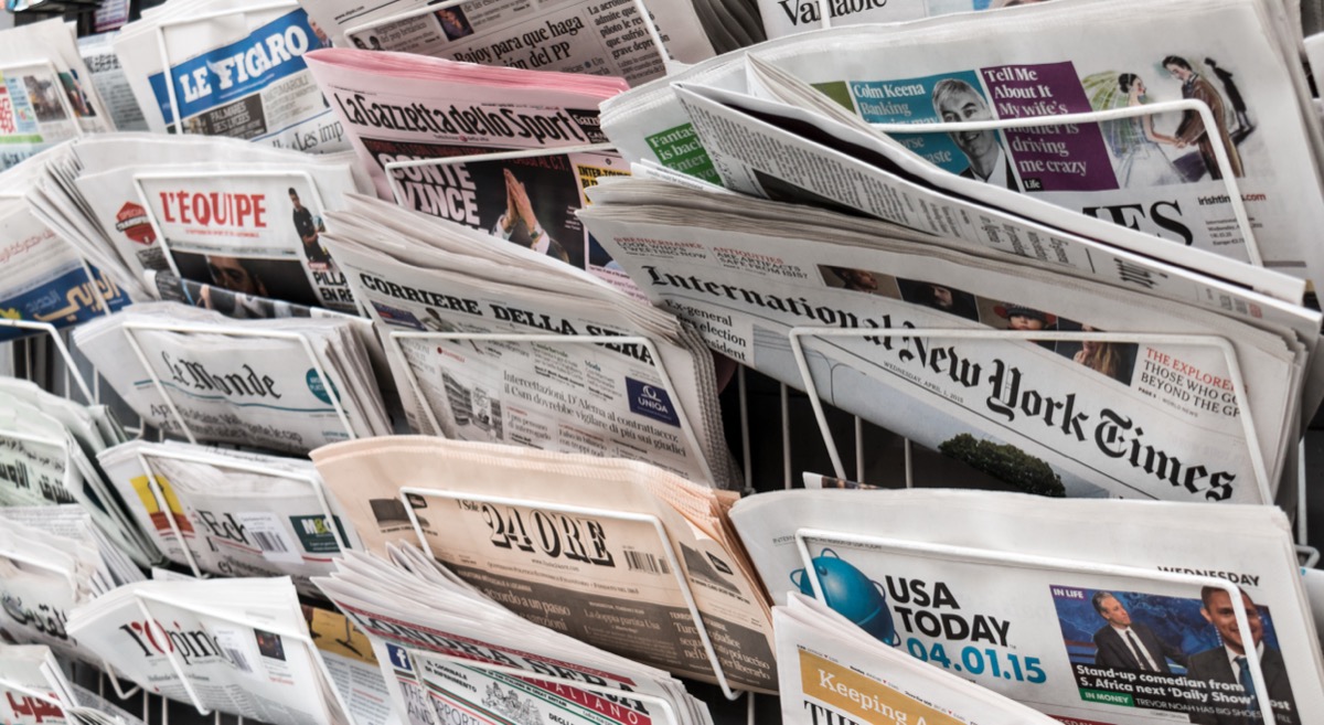 International press coverage on a newsstand
